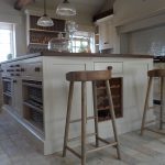 Bespoke country farmhouse kitchen island with in-built wine rack and handmade stools