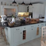 A Family Kitchen with Granite Island, Aga, Cabinets and Furniture