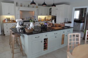 A Family Kitchen with Granite Island, Aga, Cabinets and Furniture