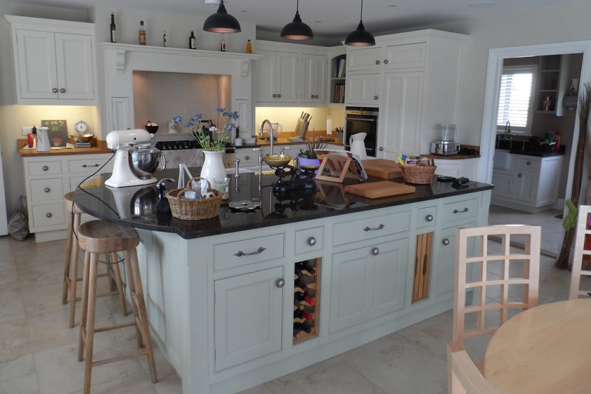 A Family Kitchen with Granite Island, Aga, Cabinets and Furniture